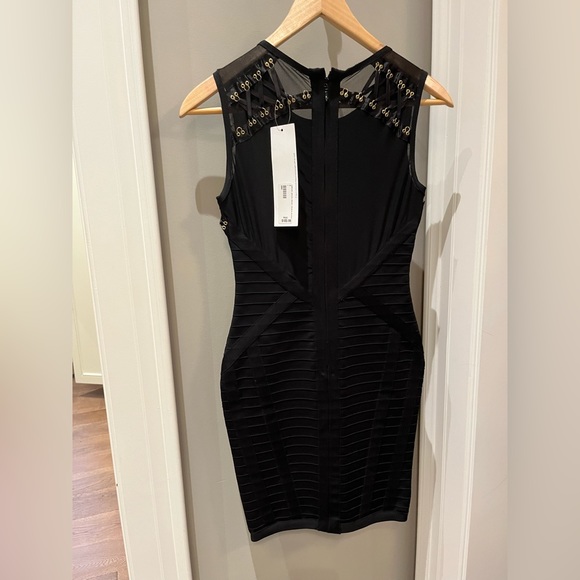Black mini bodycon dress with black lace and gold grommet details. New with tags - Picture 2 of 4